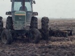 Farmer Plows a Field by KAIT-TV