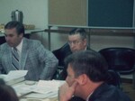 Several People Attend a 1975 Financial Report Audit