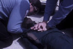EMTs Murphy and Coleman Demonstrate CPR at Health Services Conference by KAIT-TV