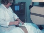 Technician Preps Woman for Ultrasound