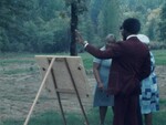 People Gather at C. A. Russell and Davies Memory Gardens by KAIT-TV
